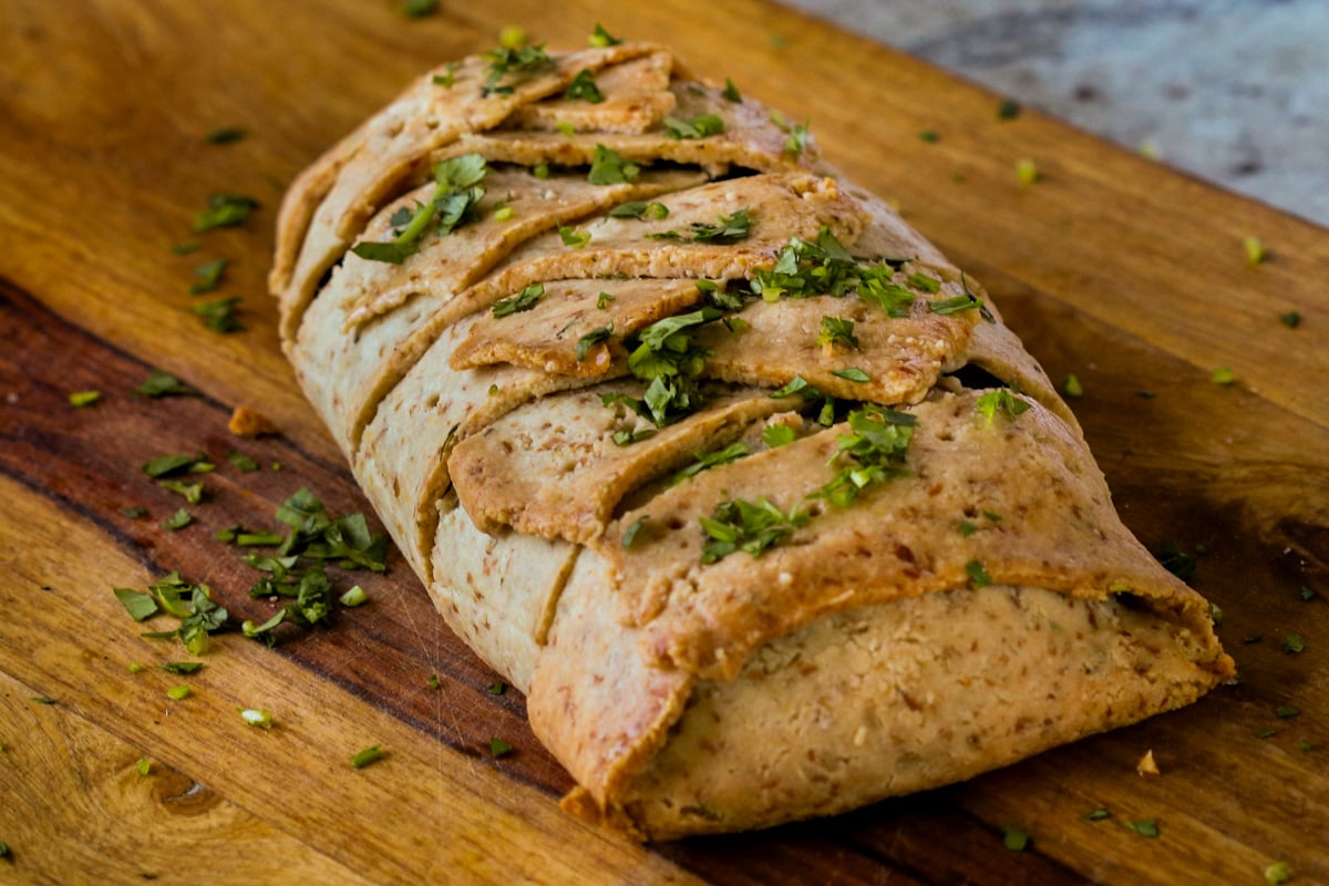 gluten-free vegan beef Wellington on the cutting board after baking