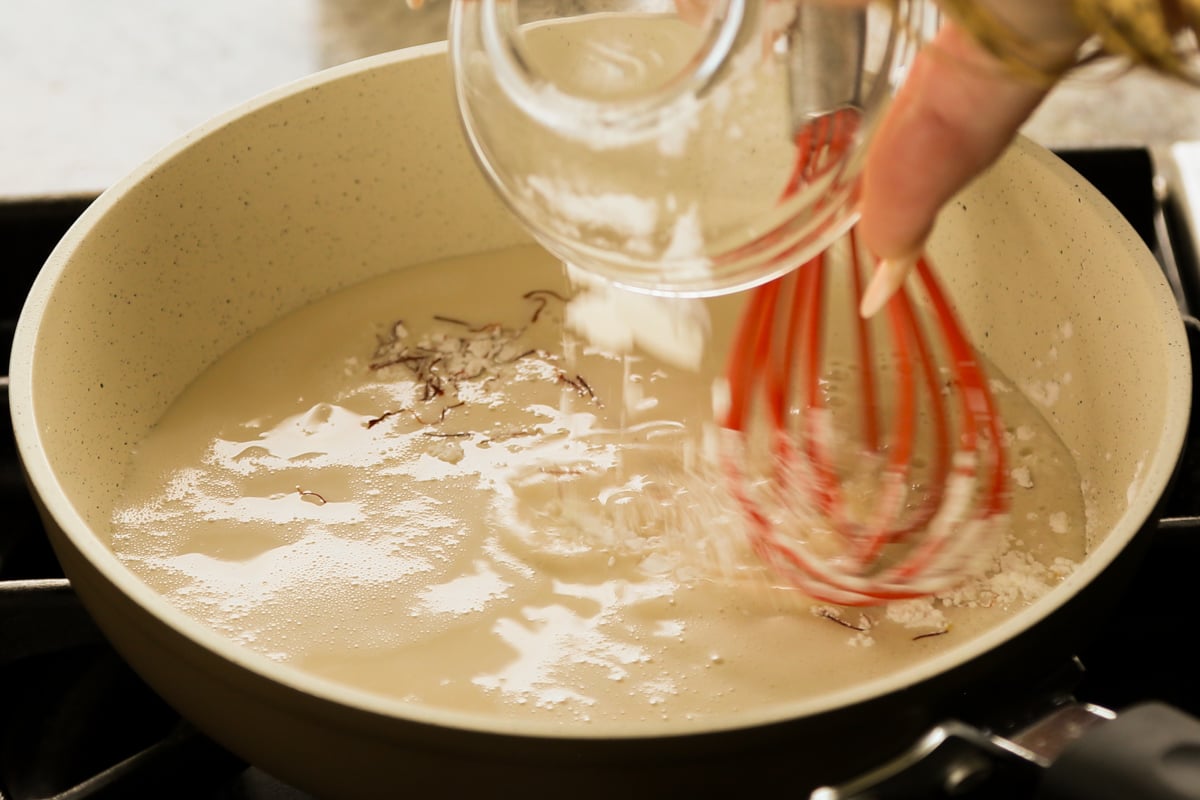 adding the custard ingredients to the pan