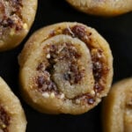 close-up of gujiya peda on a dark brown plate