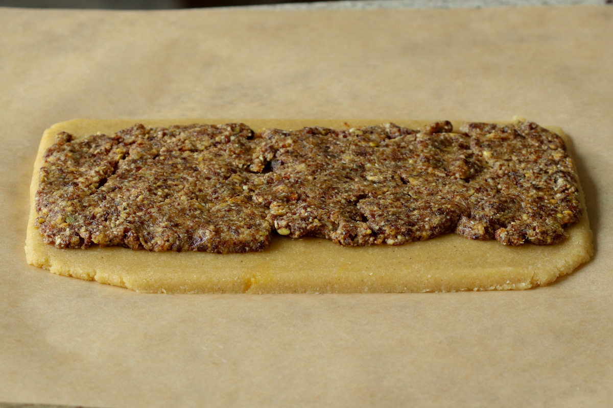peda dough after rolling out with gujiya mixture on top