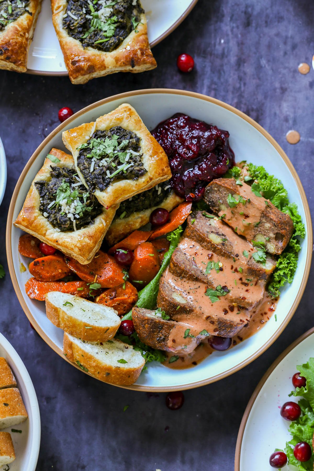 cranberry chutney on a dinner plate with other vegan Thanksgiving dishes
