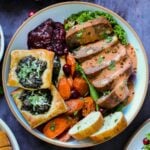 cranberry chutney on a dinner plate with other vegan Thanksgiving dishes