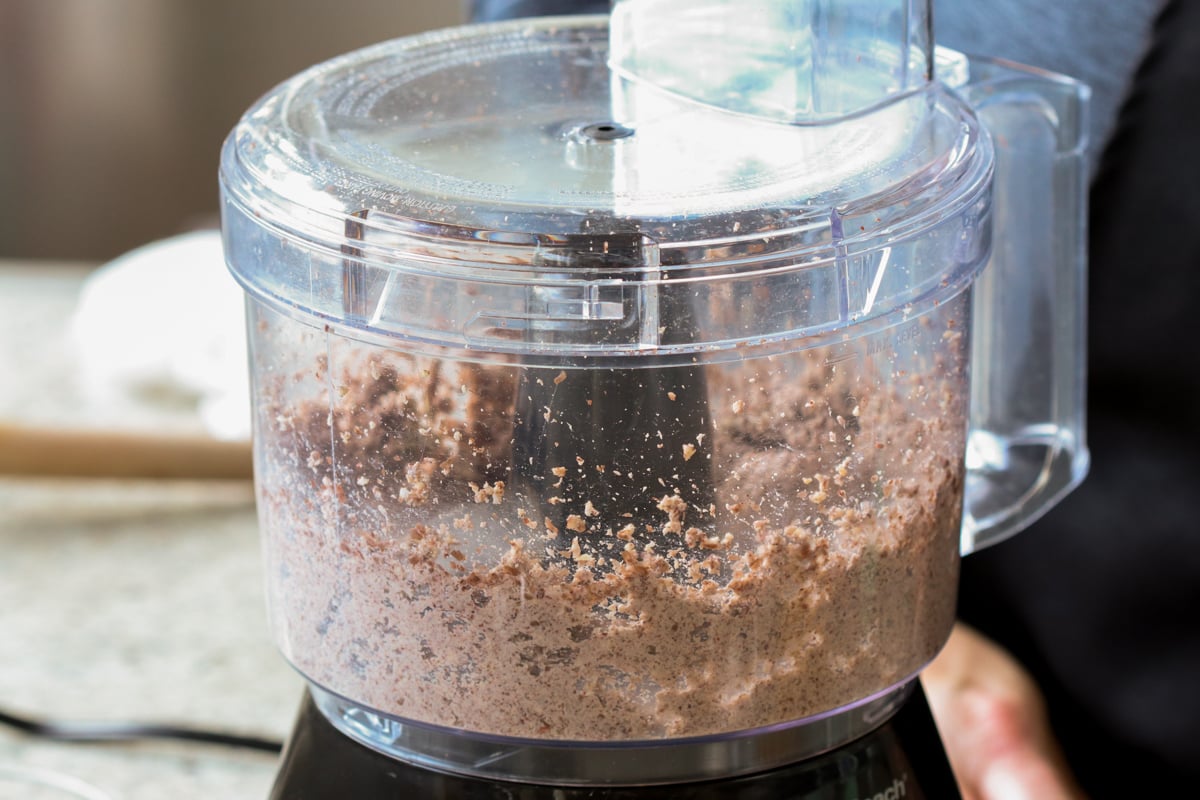 pecans, chickpeas, and mushrooms in the food processor after processing