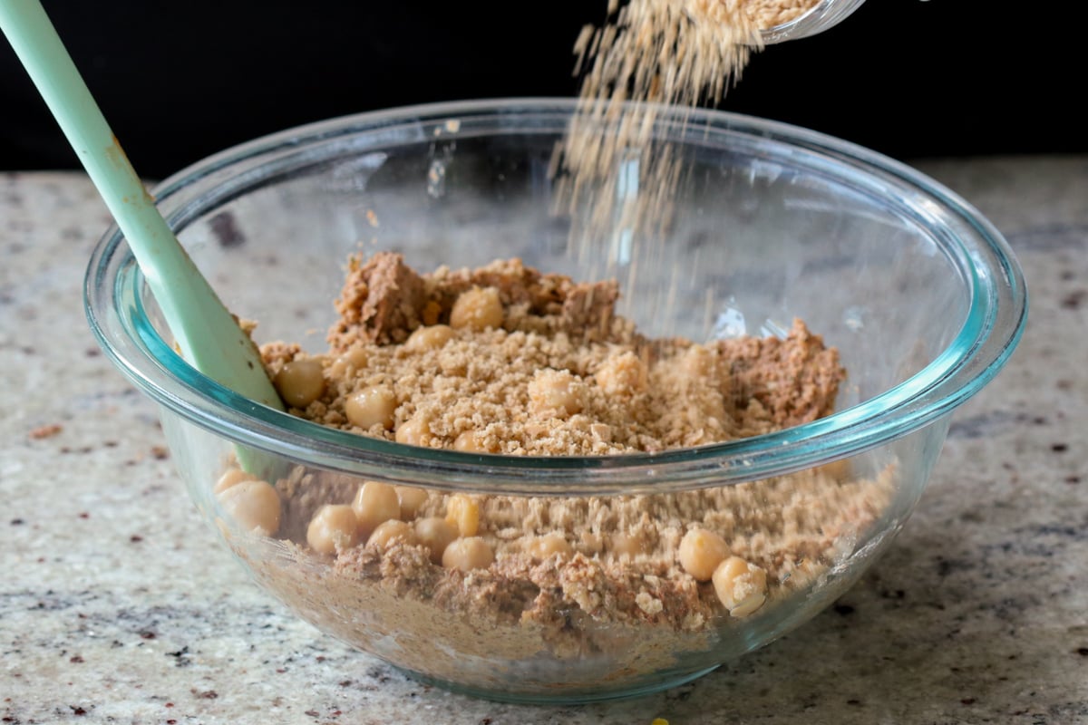 adding chickpeas and breadcrumbs to the mixture