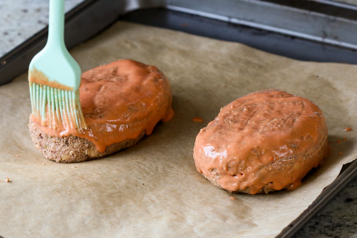 brushing the loaves with butter sauce