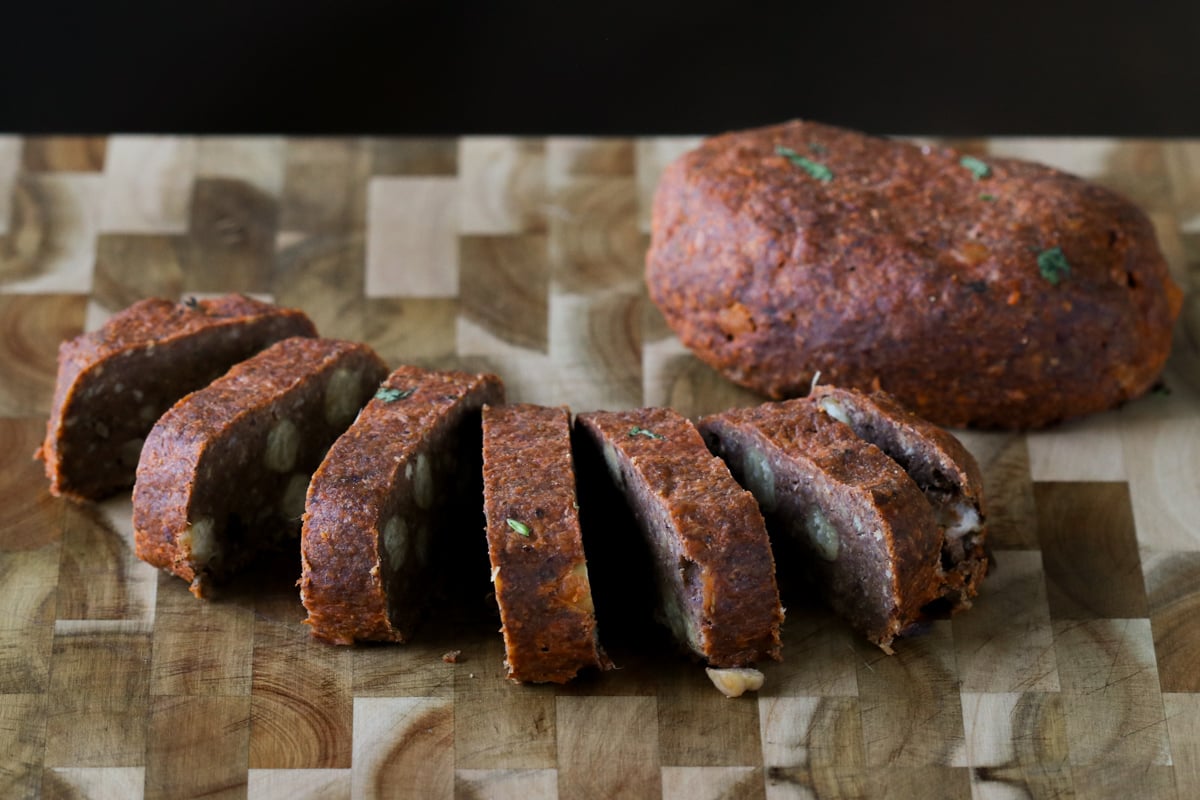 sliced chickpea loaf on a cutting board