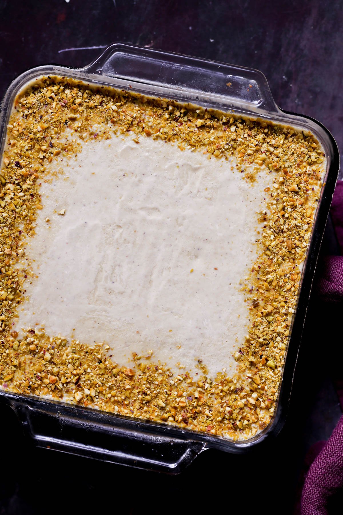 kulfi tiramisu in the pan before chilling