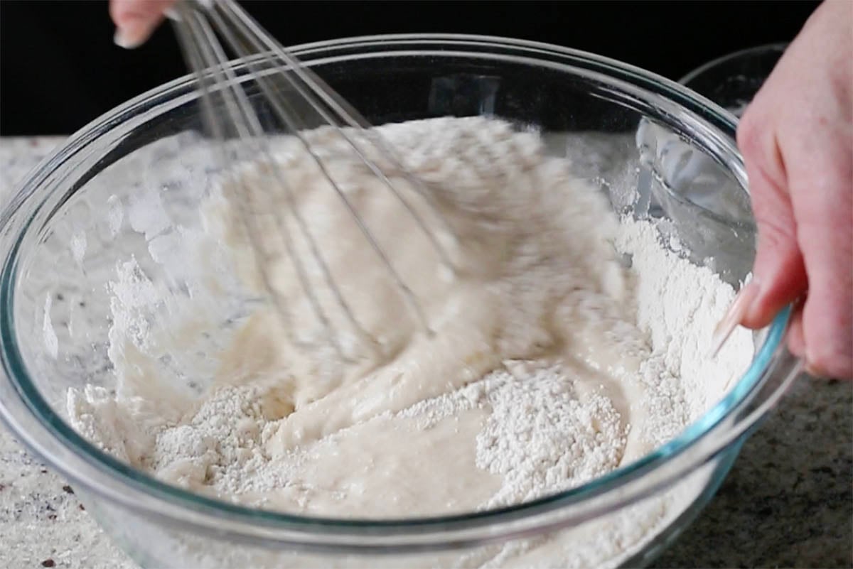 mixing the cake batter in the bowl