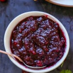 bowl of cranberry chutney as part of a Thanksgiving spread