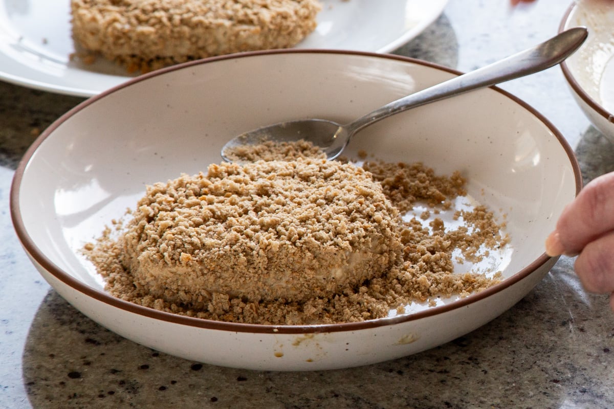 adding breadcrumbs to battered tofu