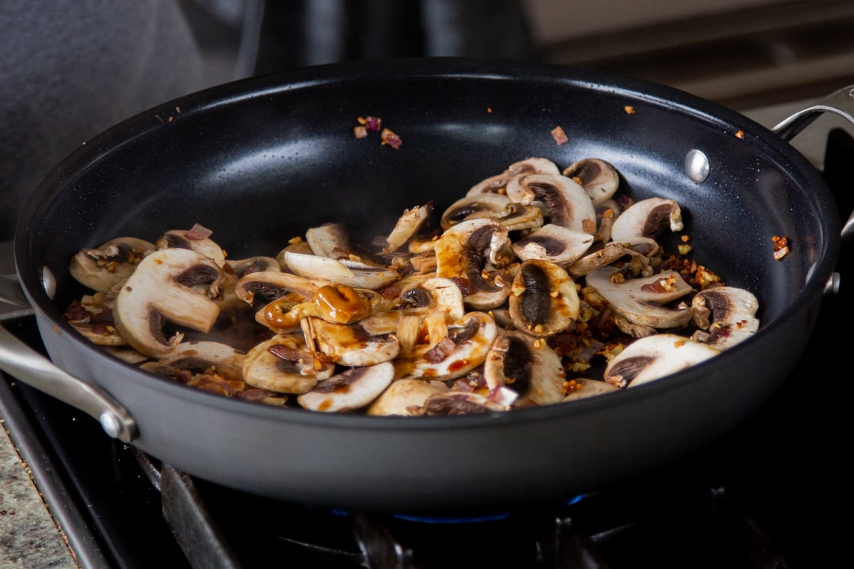 adding sauces to the mushrooms