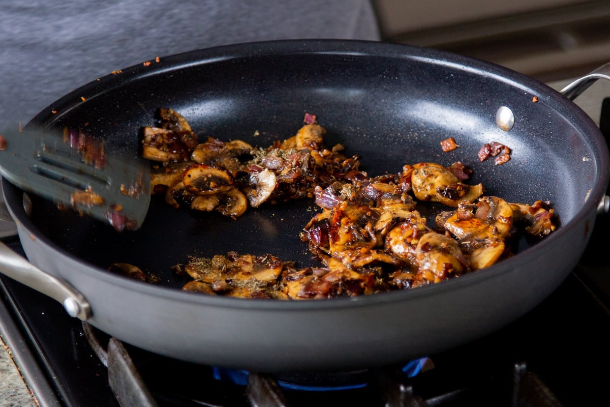 adding seasoning to the mushrooms