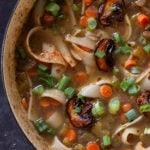 close-up of mushroom noodle soup in the pan