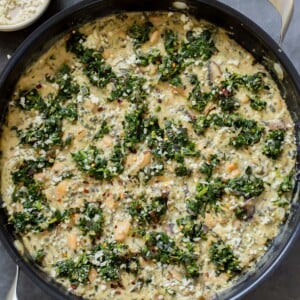 vegan white bean mushroom alfredo in the pan with spinach