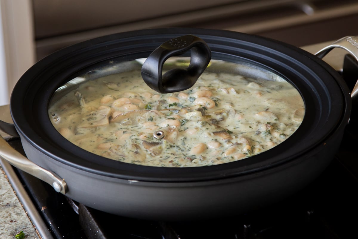 white bean mushroom alfredo in the pan with the lid on it