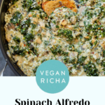 vegan white bean mushroom alfredo in the pan with spinach, text overlay