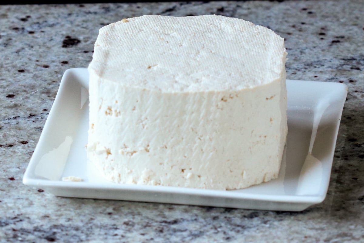 block of tofu cut with rounded corners