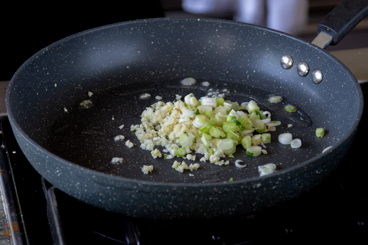 green onion in the pan before cooking