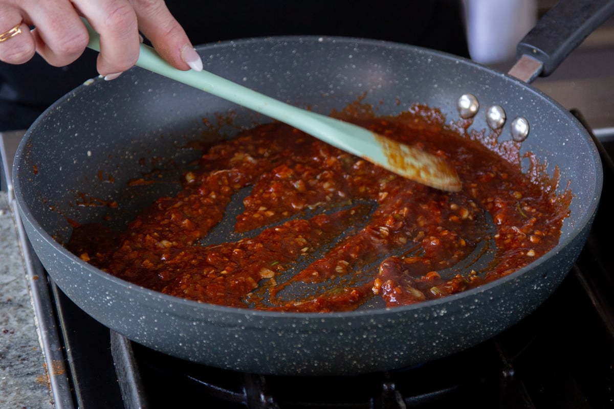 mixing the sauce ingredients in the pan