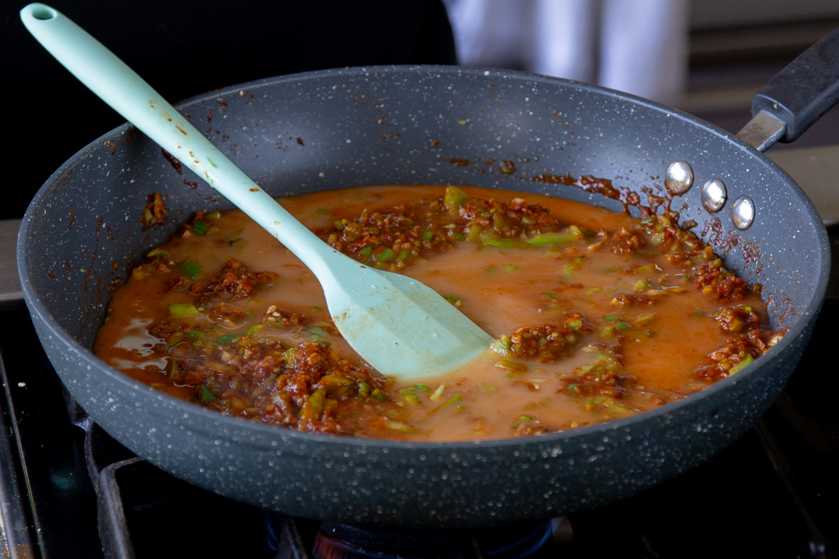 adding cornstarch mixture to the sauce