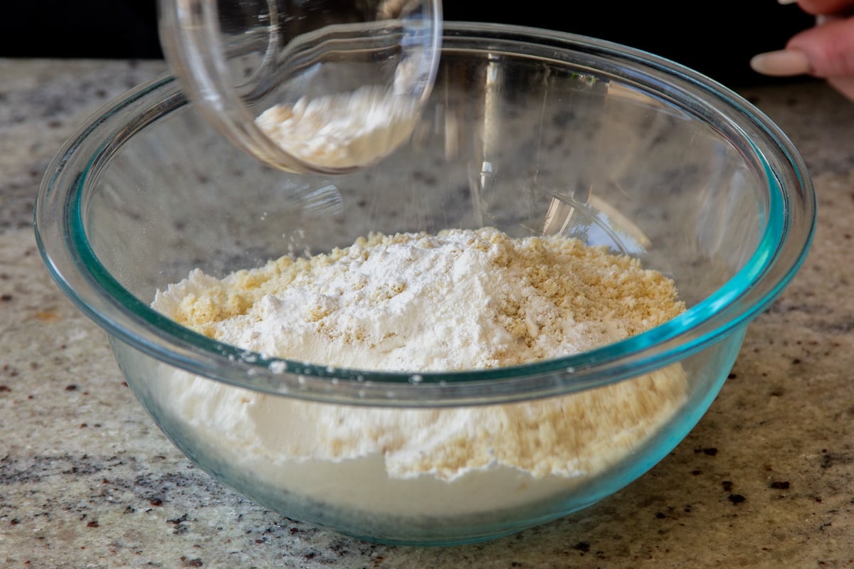 adding the dry ingredients to the bowl