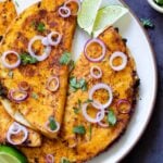 mushroom quesatacos on a plate with onions, cilantro, and lime