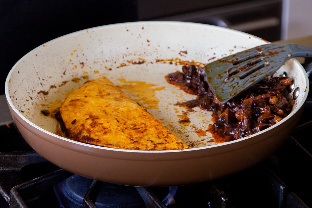 quesataco in the pan after flipping