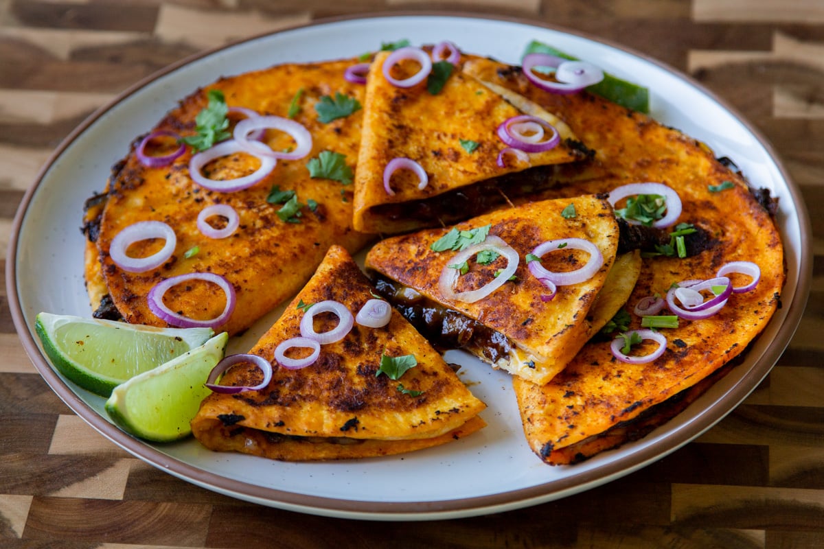 mushroom quesatacos cut up on a plate