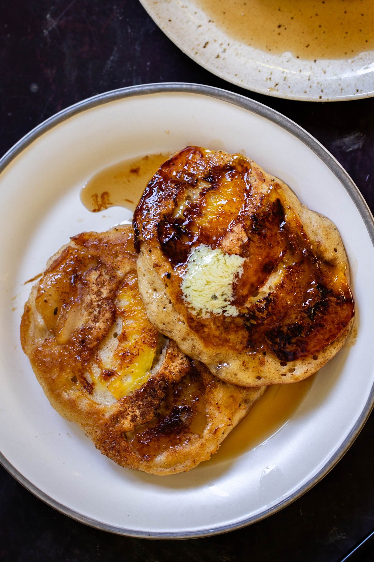 a plate of peach upside-down pancakes