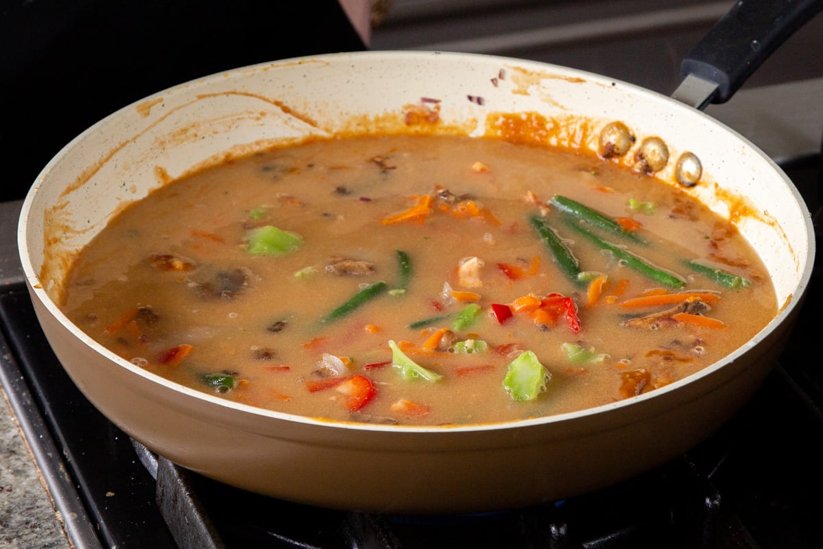 veggies in the peanut gochujang sauce after mixing
