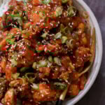 extreme close-up of baked mushroom tofu stir fry in a bowl