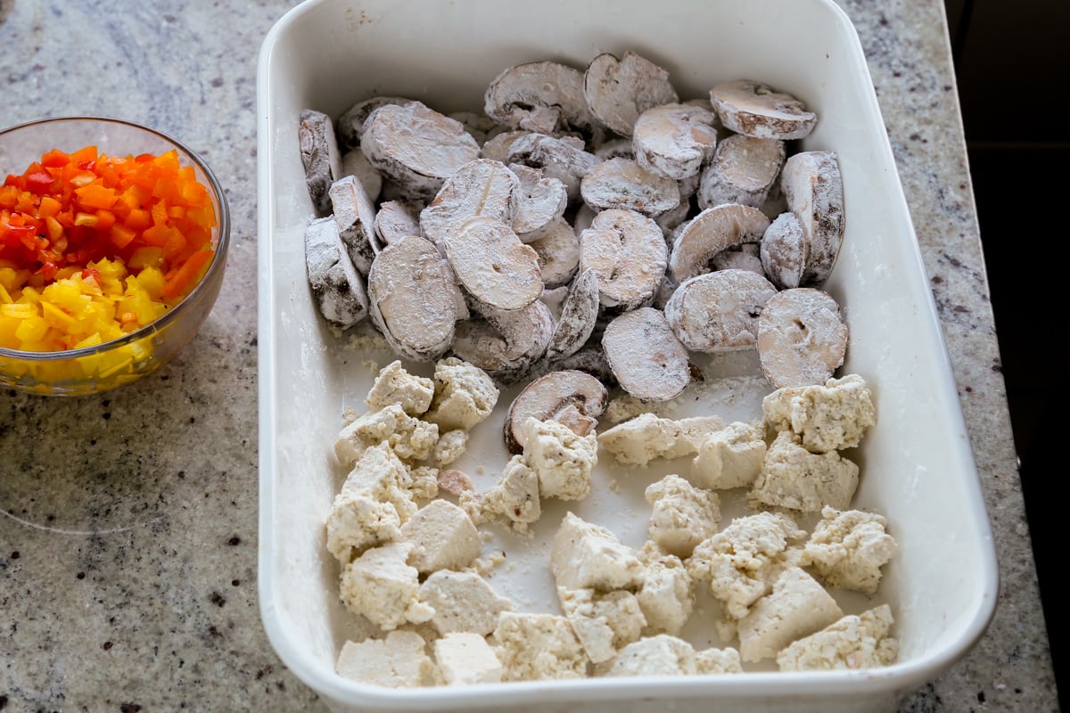 adding tofu to the pan
