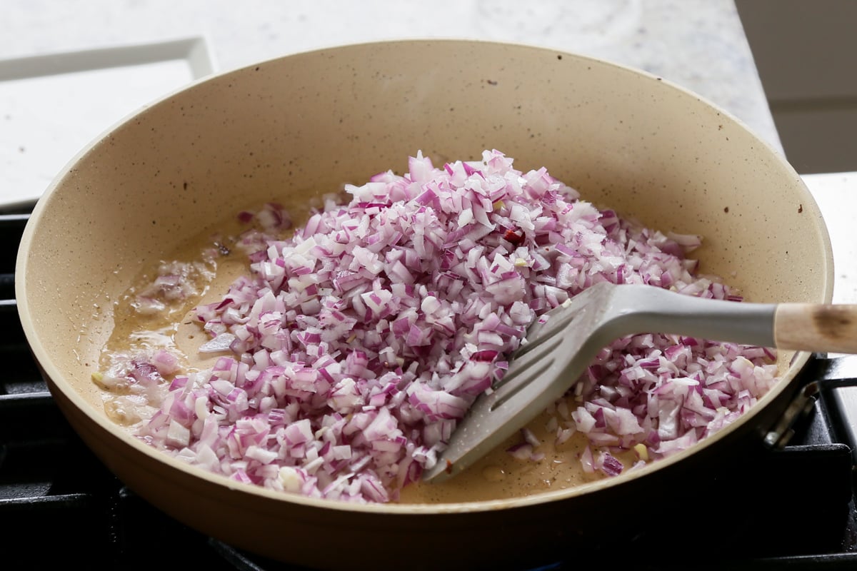 adding onion and salt to the skillet