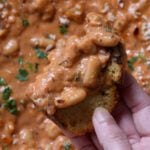 close up of rosé sauce beans on sourdough bread