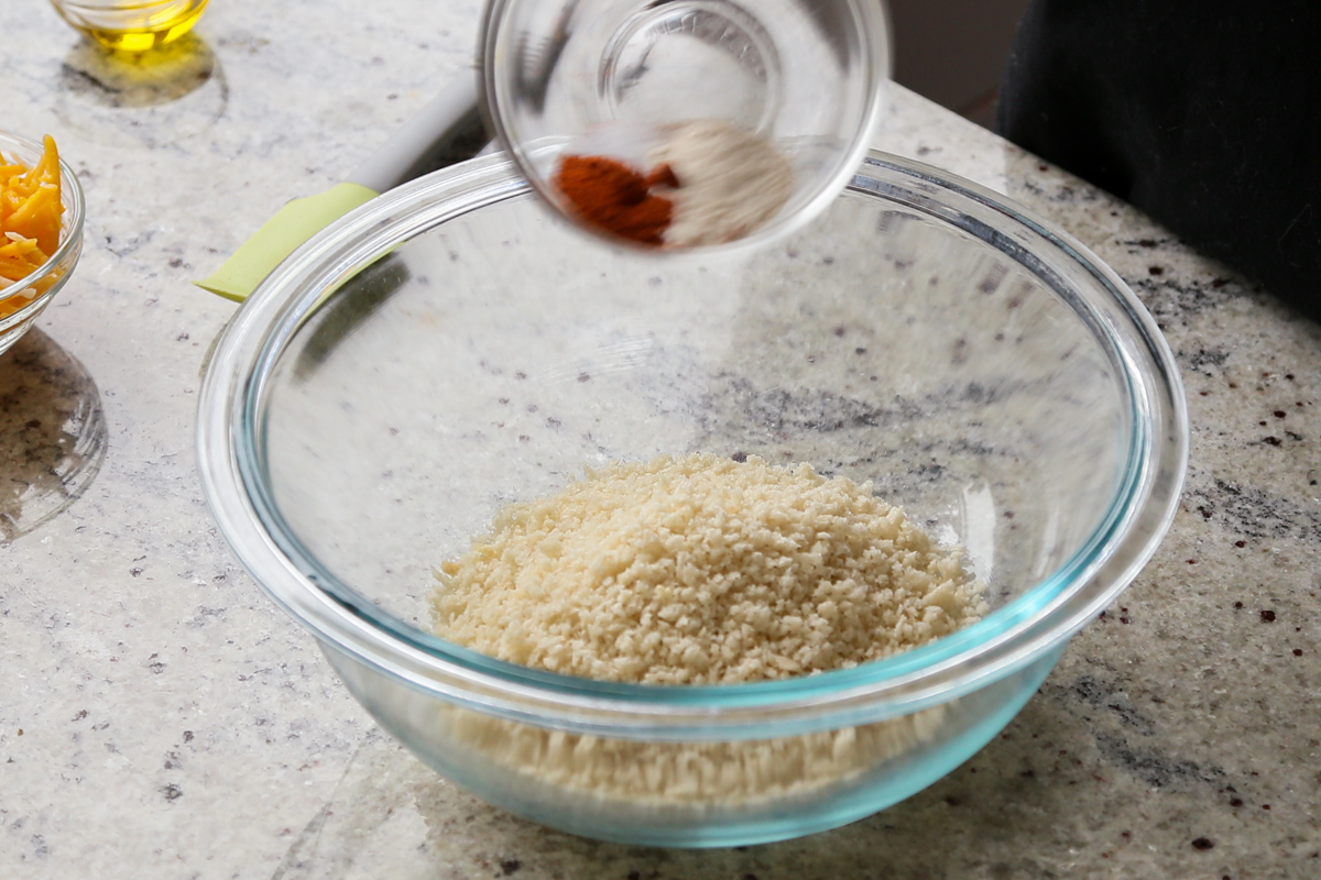adding spices to the breadcrumbs