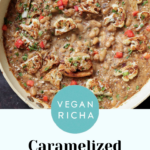 caramelized onion beans in the pan topped with charred cauliflower, tomato, and herbs, text overlay