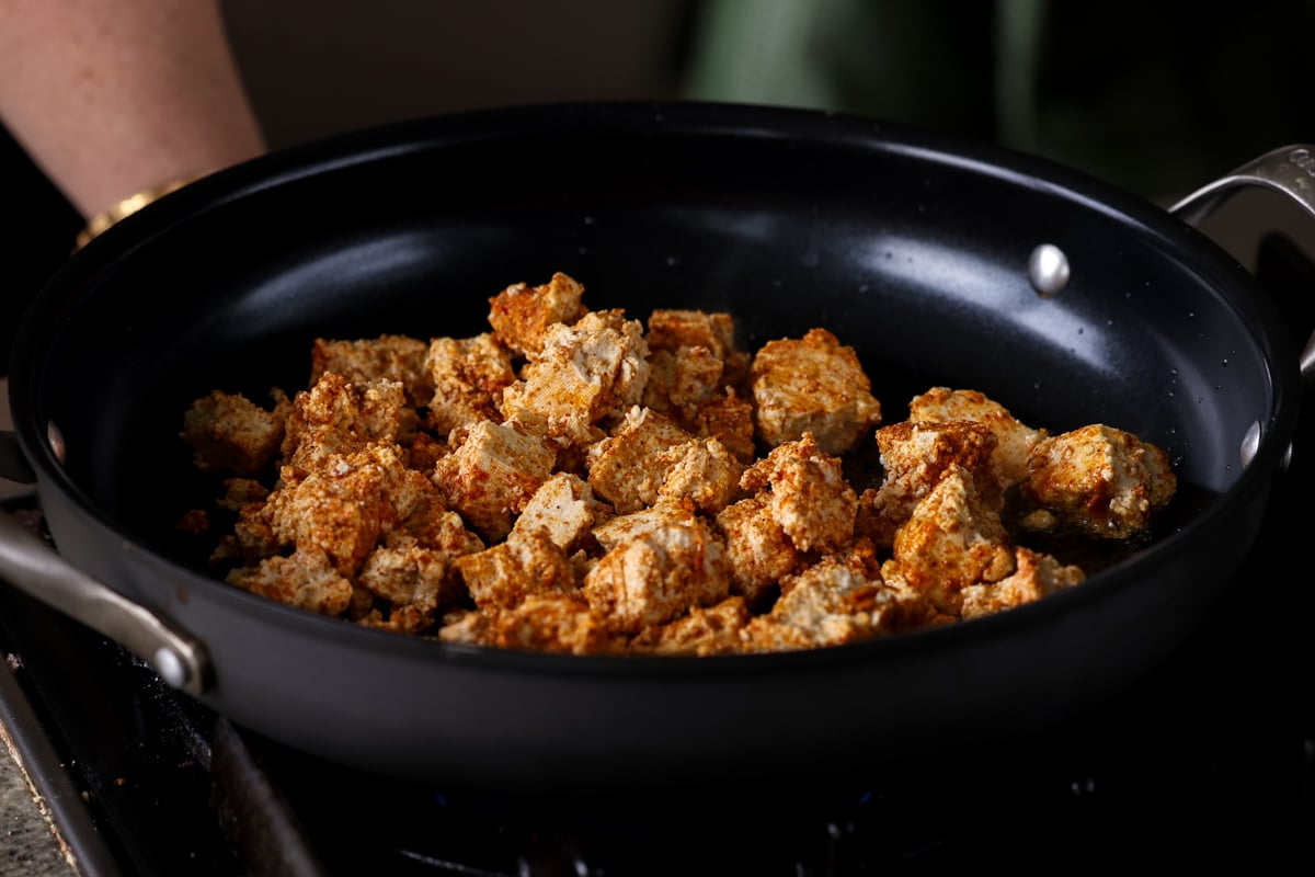 crisping up the tofu in the pan