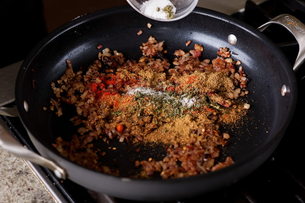 adding ground spices to the pan