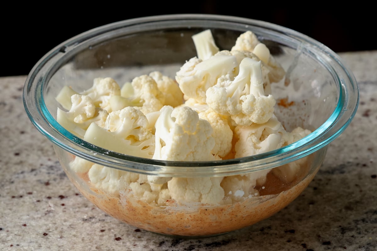 adding cauliflower to the batter