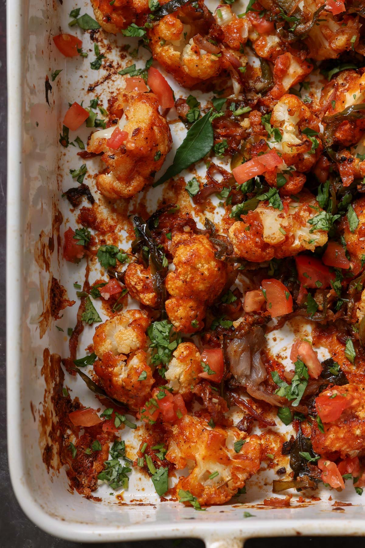 close up of cauliflower pepper fry in the pan after baking and mixing together