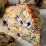 close-up of a glazed lemon blueberry scone