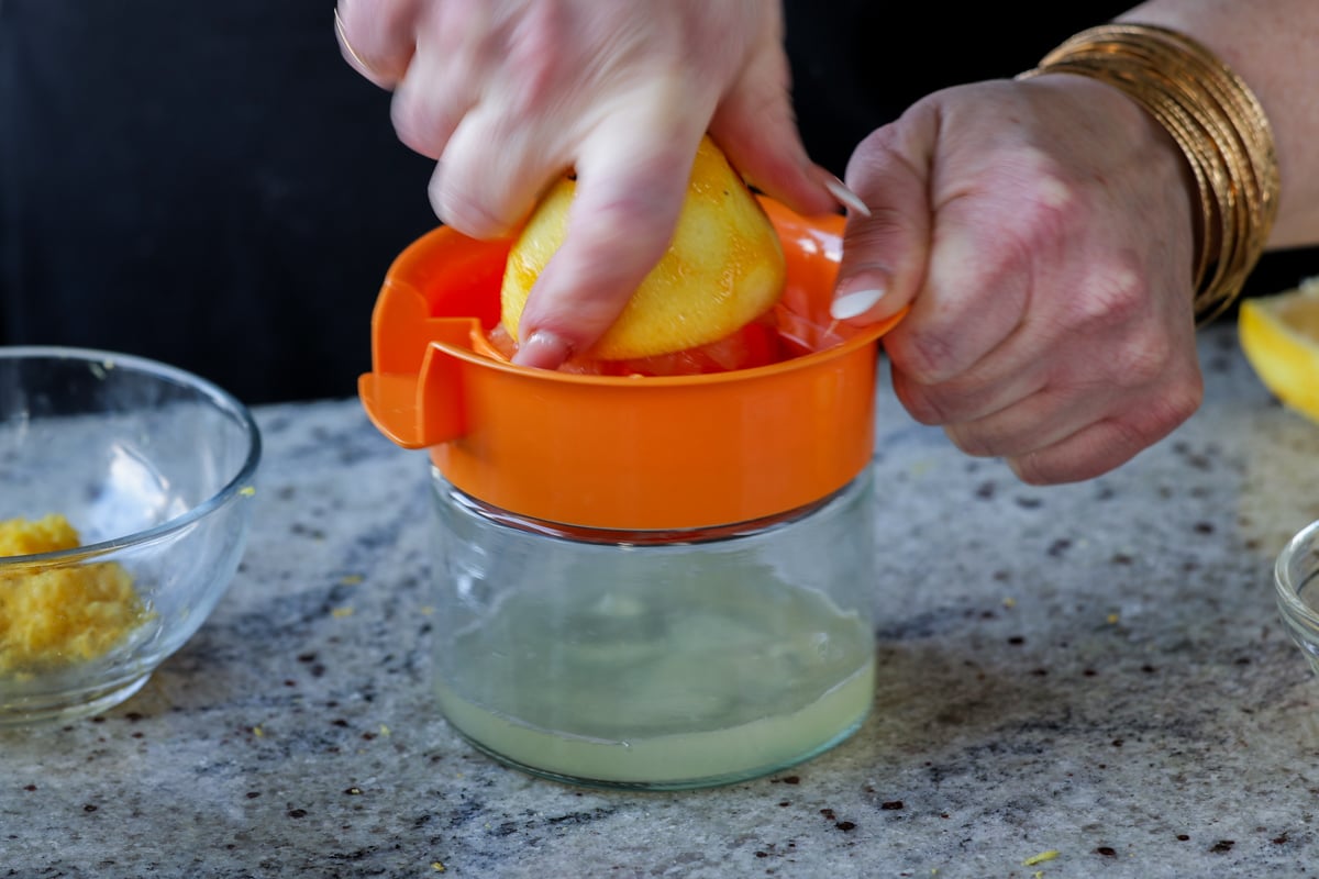 juicing the lemon after zesting in