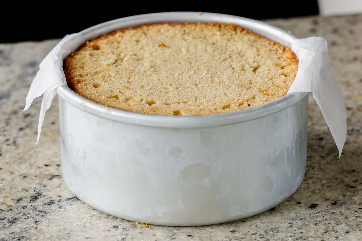 adding the second cake layer to the pan