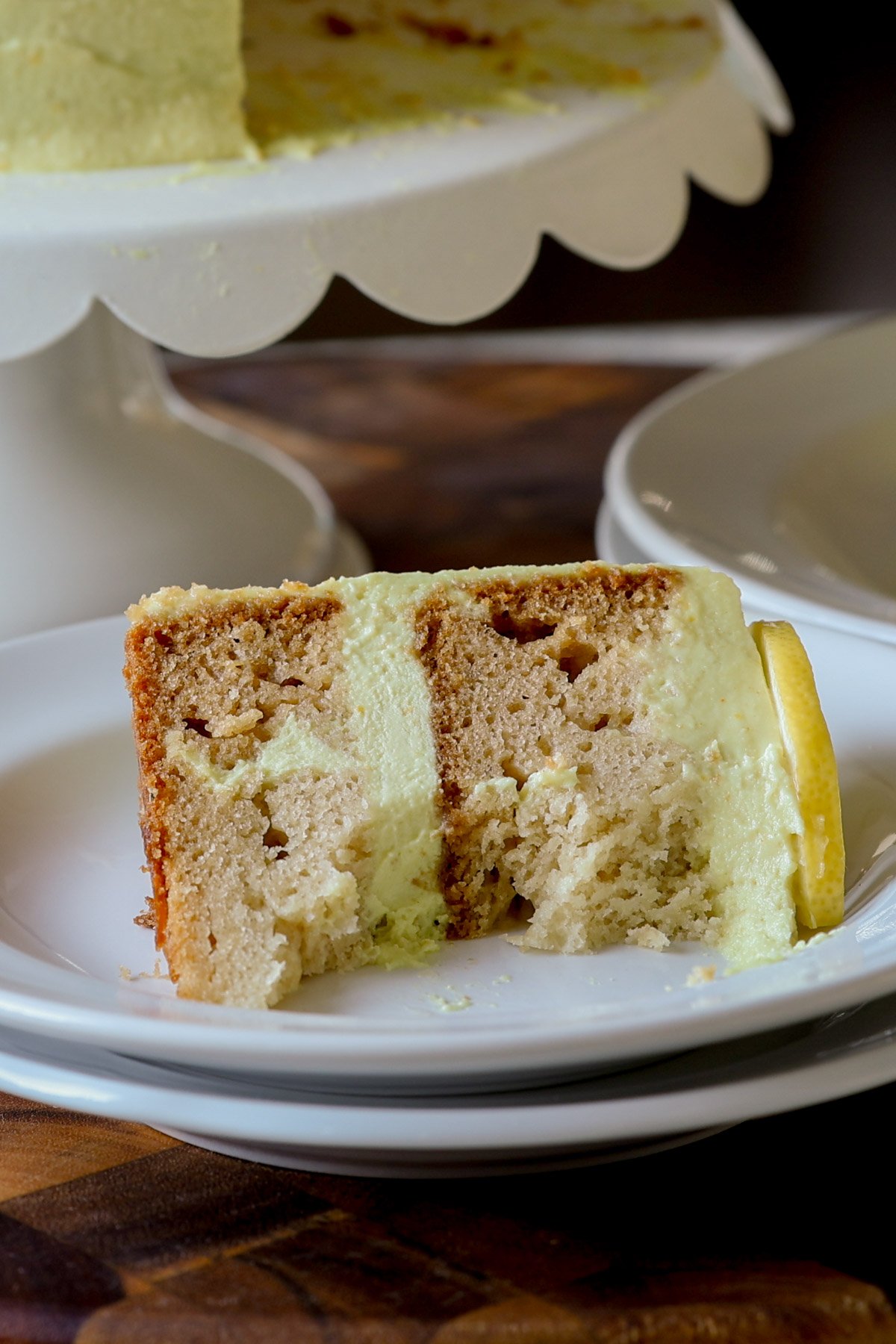 slice of lemon cake with bites taken out
