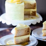 vegan lemon cake on the cake stand next to slices of the cake