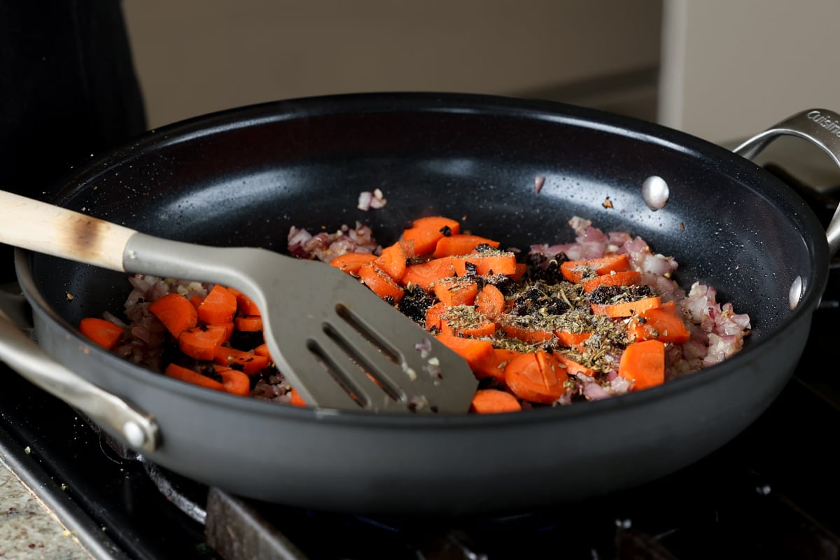 ado carrots, celery, and herbs to the cooked onion and garlic