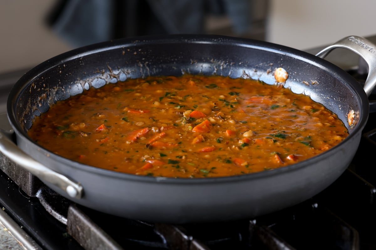 lentil chickpea stew after cooking the spinach and parmesan into the sauce