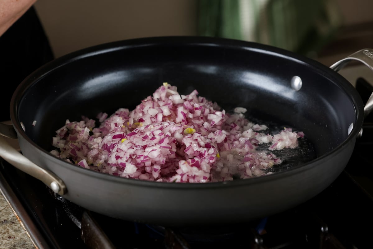 adding onion to the pan