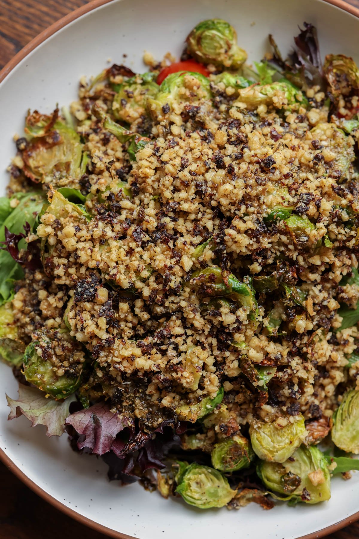 walnut crumble on top of the salad before mixing in