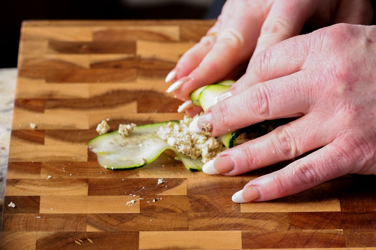 rolling up the zucchini